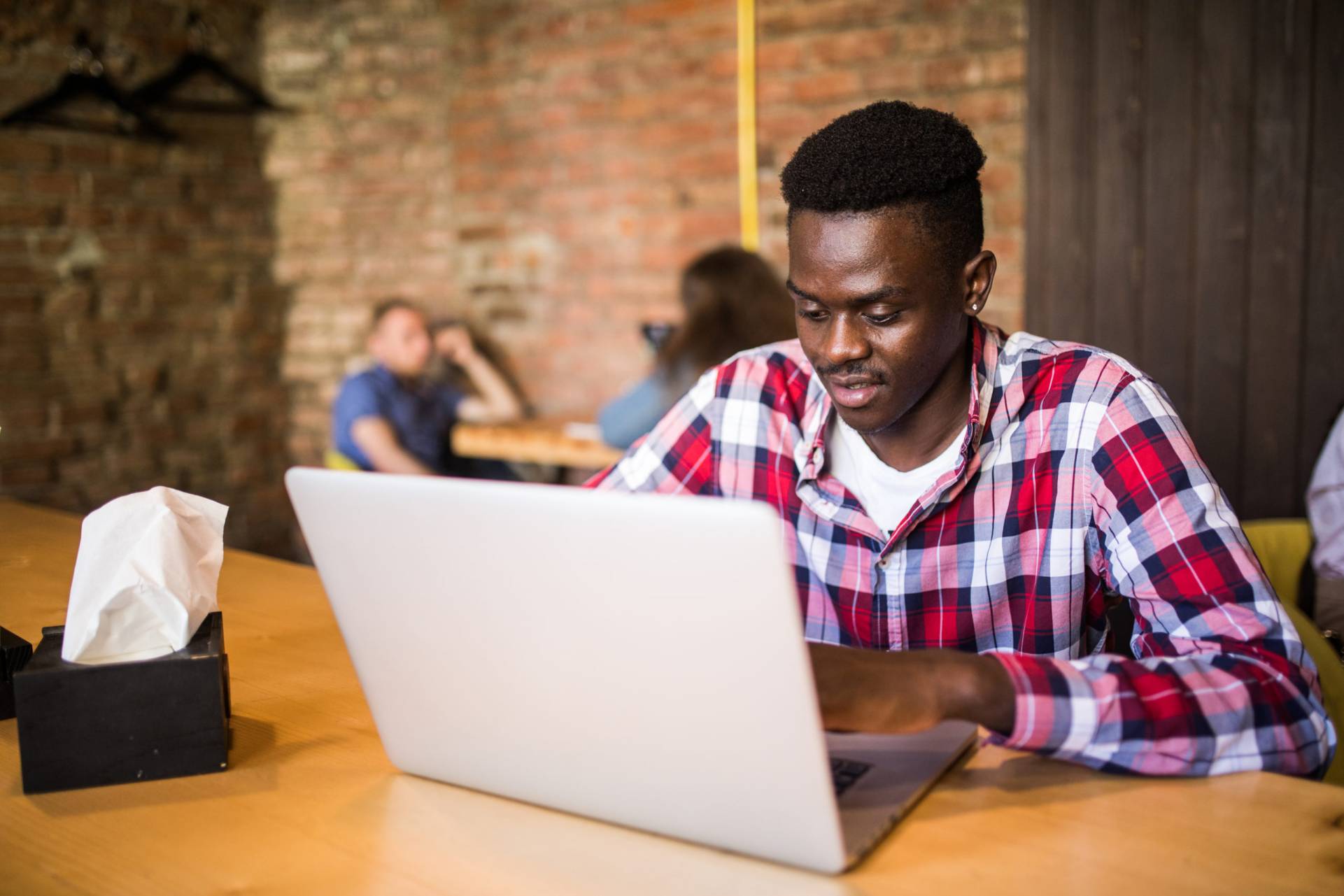 portrait african american man sitting cafe working laptop scaled
